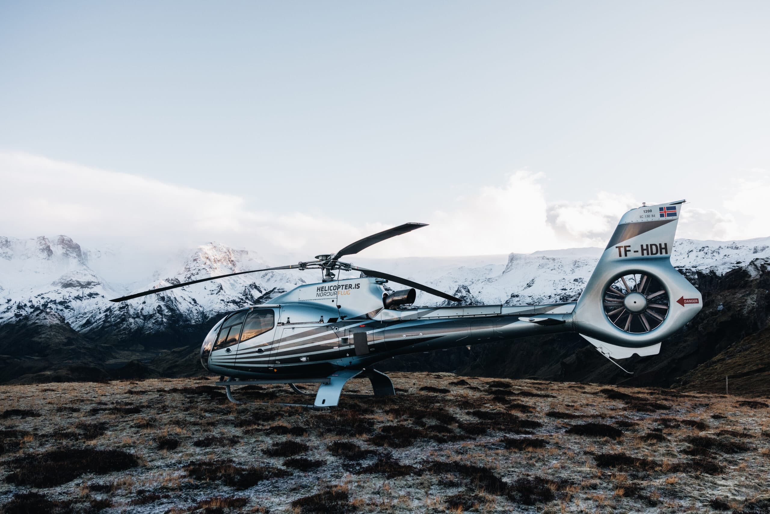 Person taking picture in a helicopter