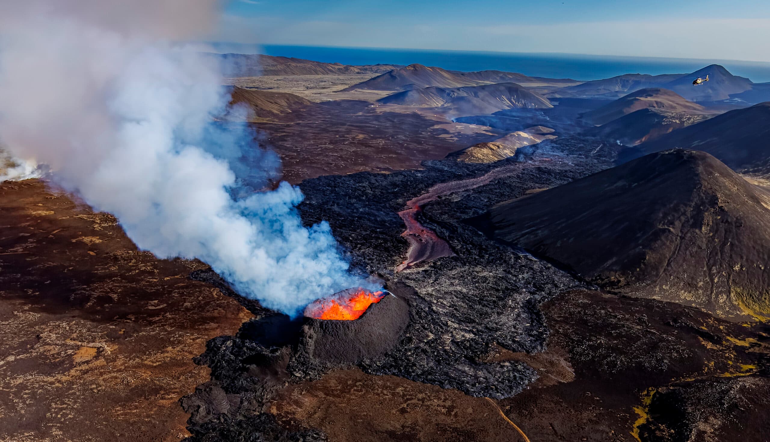 Person taking picture in a helicopter