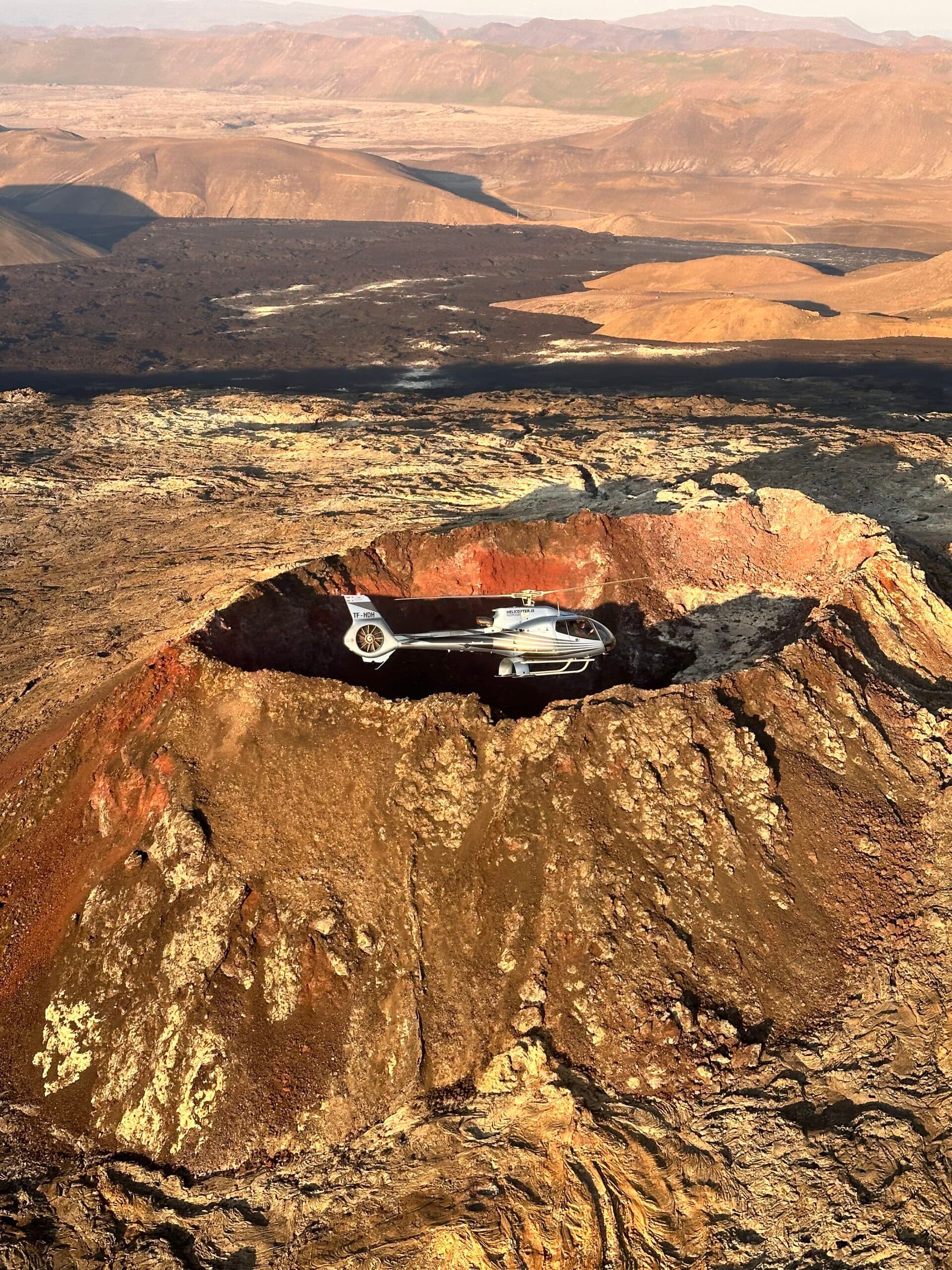 Helicopter flying over a mountain range