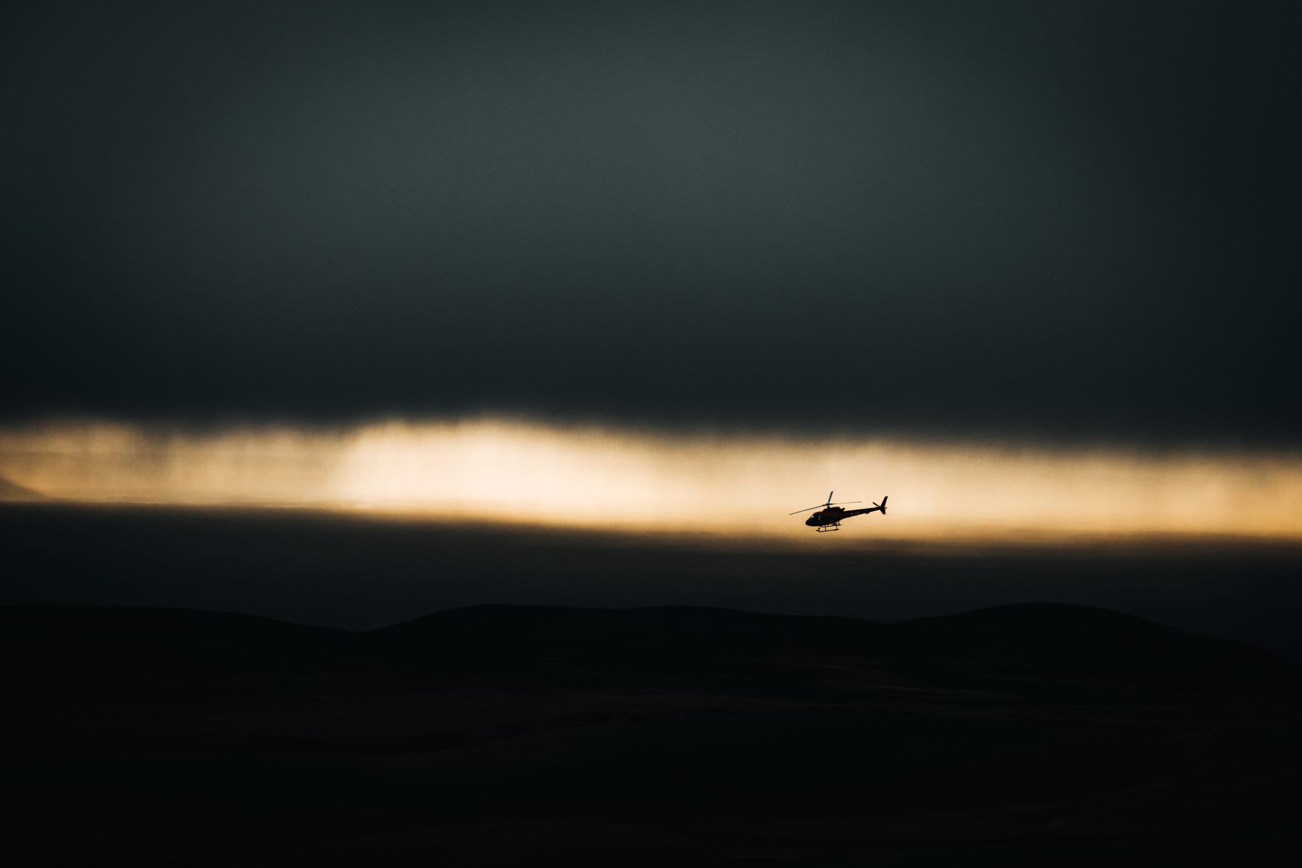 Person taking picture in a helicopter