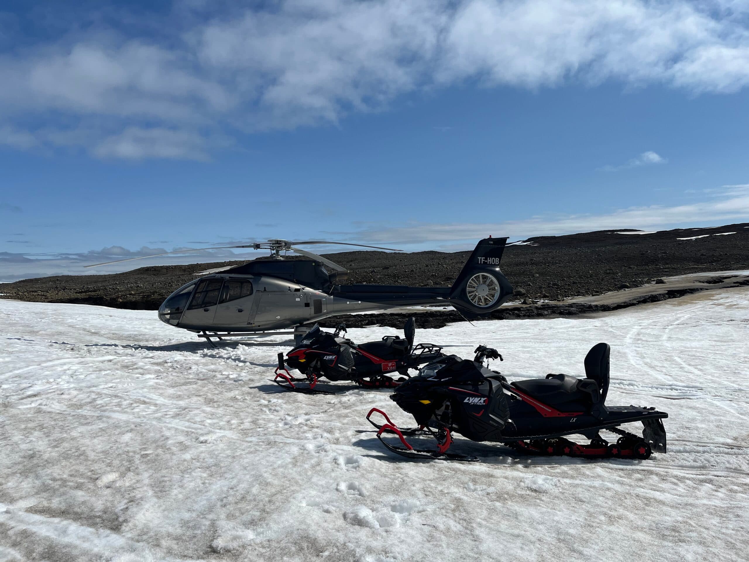 Helicopter flying over a mountain range
