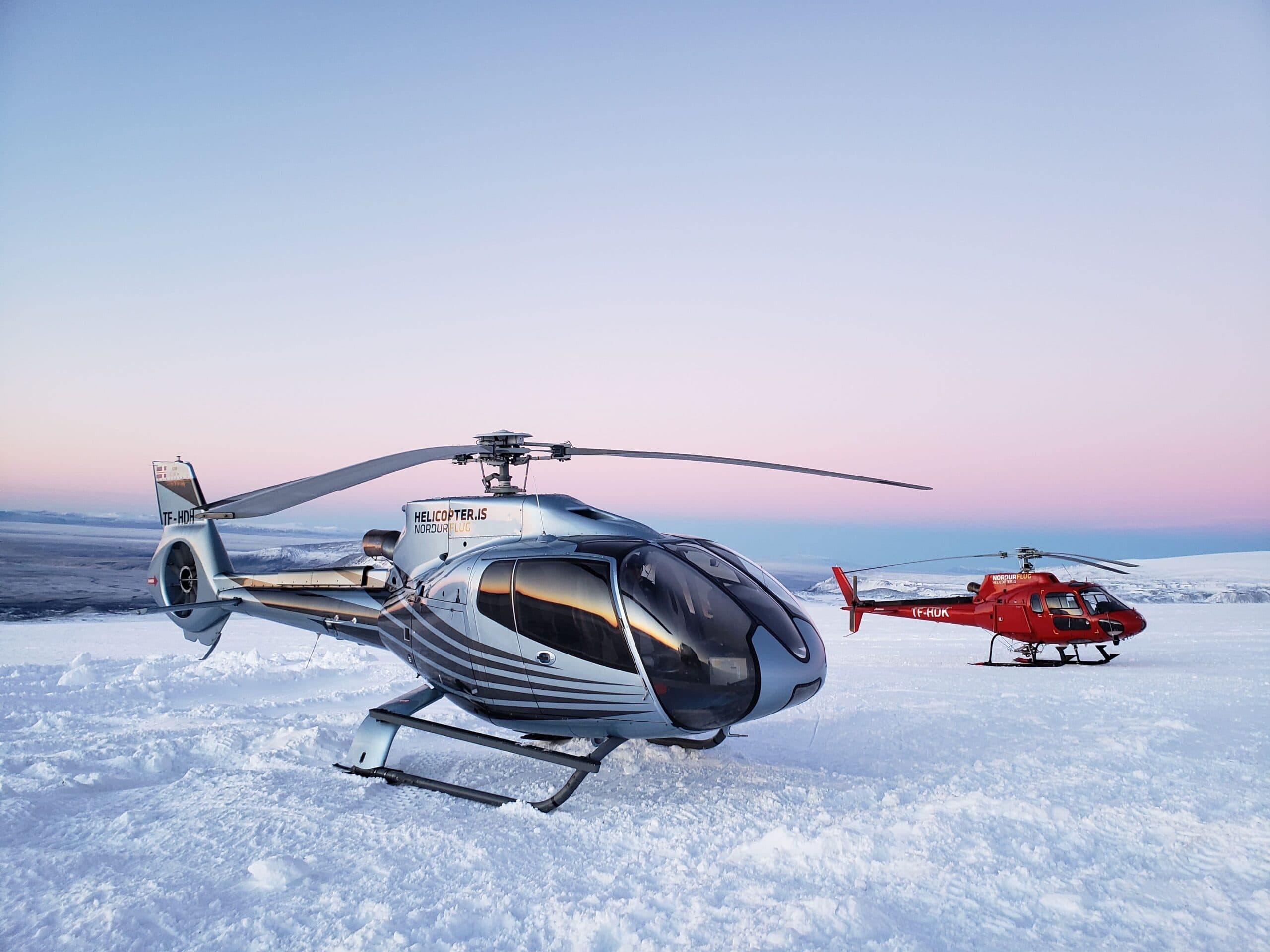 Helicopter flying over a mountain range
