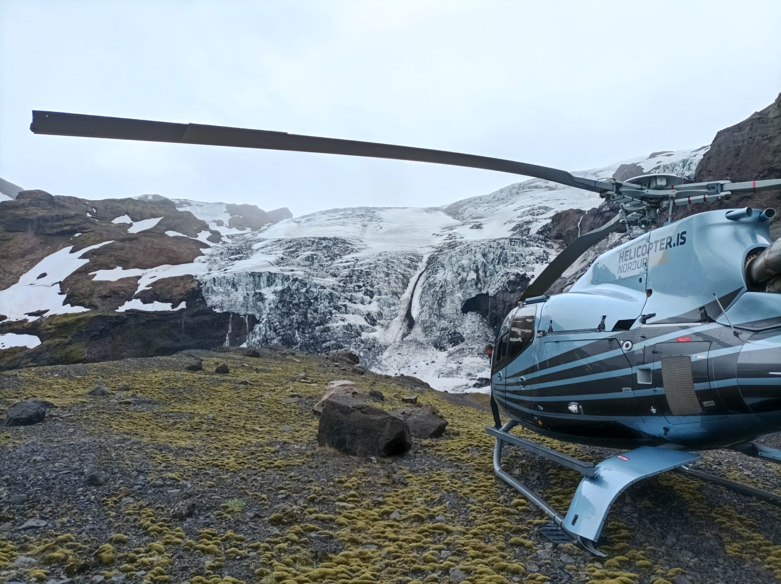 Helicopter flying over a mountain range