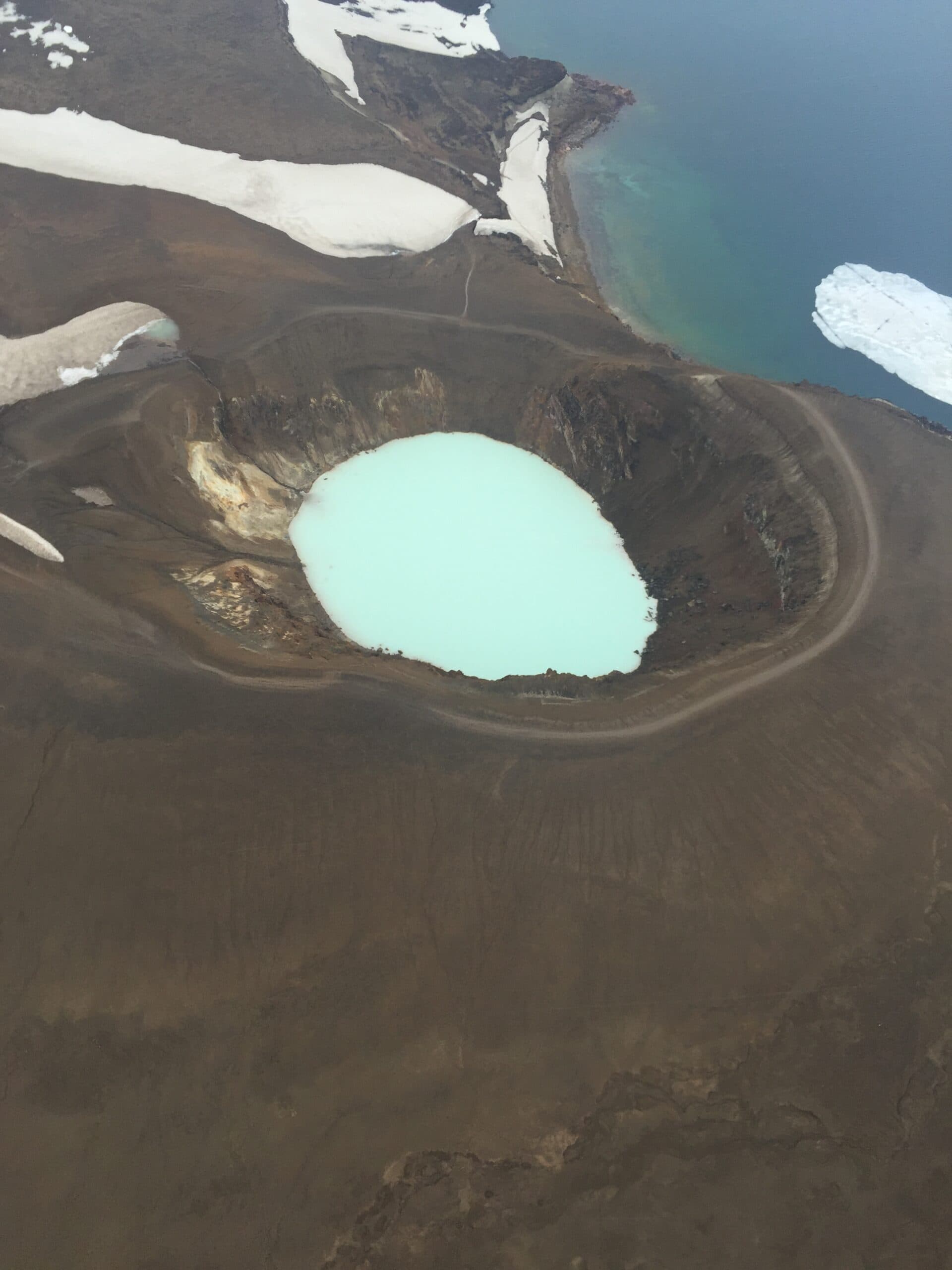 Person taking picture in a helicopter