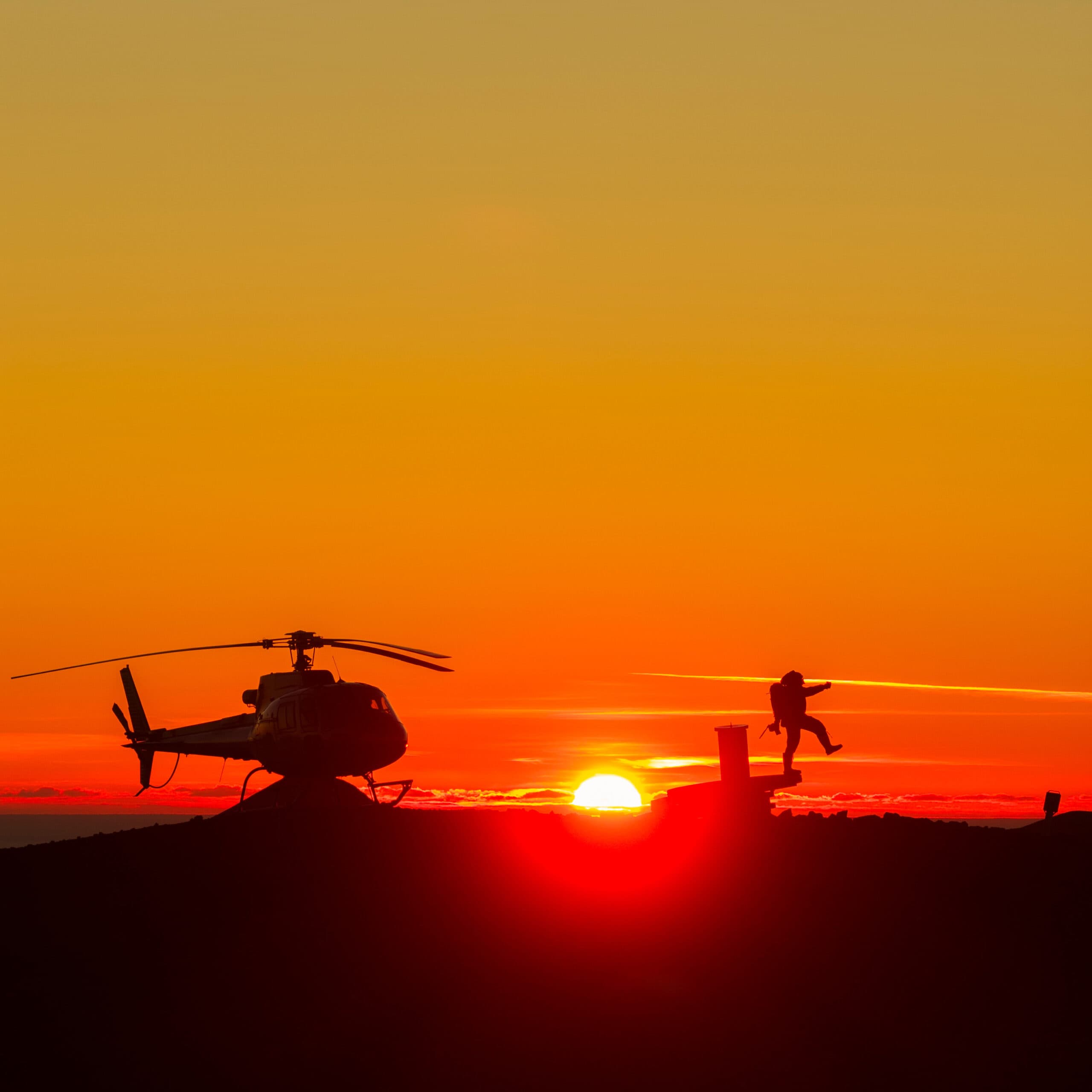 Person taking picture in a helicopter